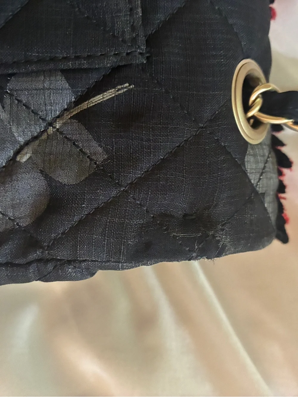 CHANEL Black Quilted Shoulder Bag with Red Floral Appliqués